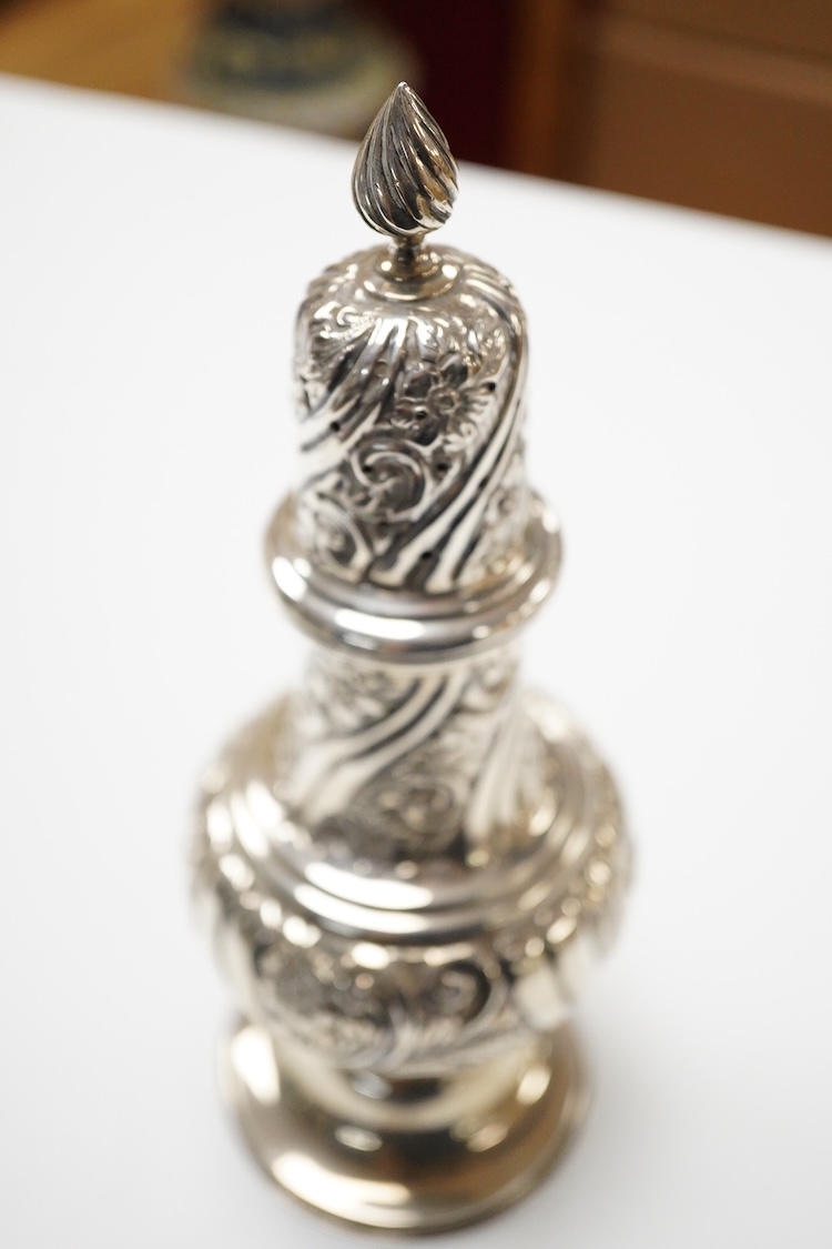 An Edwardian repousse silver sugar caster, by William Aitken, Birmingham, 1902, height 22.2cm, 5.8oz.